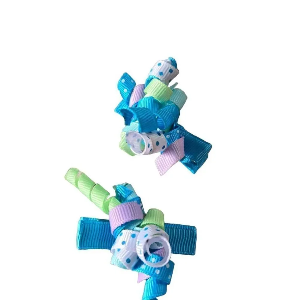 2 sets of infant twirly bows, 2